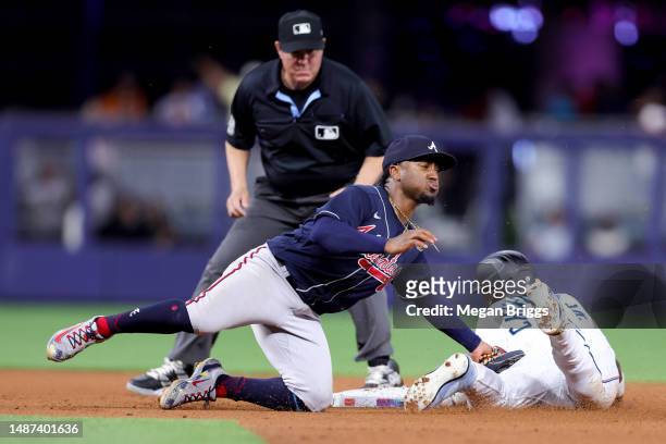 Ozzie Albies of the Atlanta Braves tags out Jazz Chisholm Jr. #2 of the Miami Marlins during the fourth inning at loanDepot park on May 03, 2023 in...