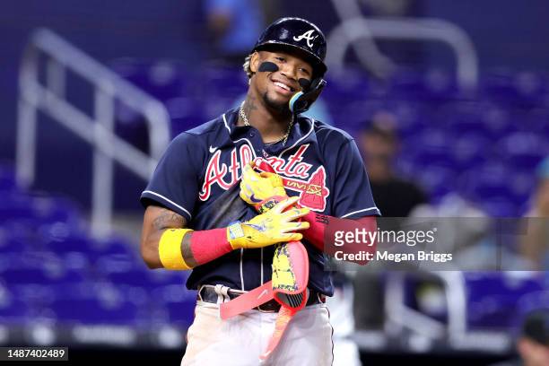 Ronald Acuna Jr. #13 of the Atlanta Braves reacts after striking out against the Miami Marlins during the ninth inning at loanDepot park on May 03,...