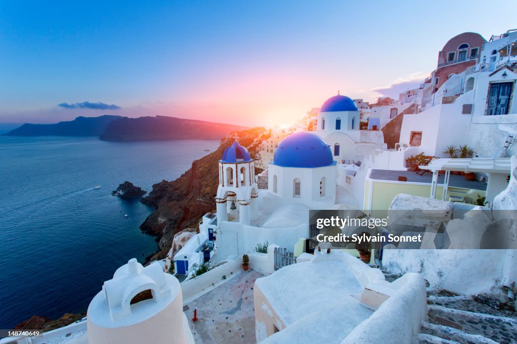 Blue domed churches at sunset, Oia, Santorini