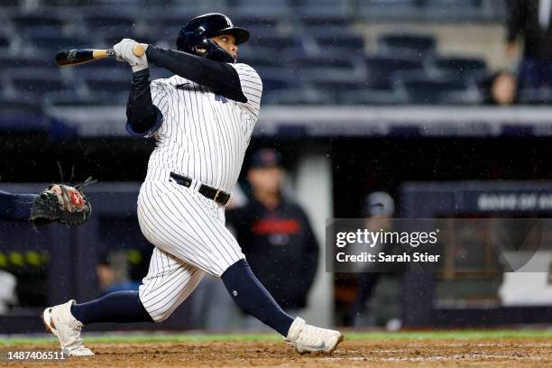 Willie Calhoun of the New York Yankees hits an RBI single allowing Aaron Hicks to score a game-tying run during the ninth inning against the...