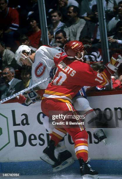 Gary Roberts of the Calgary Flames checks Eric Desjardins of the Montreal Canadiens during the 1989 Stanley Cup Finals in May, 1989 at the Montreal,...