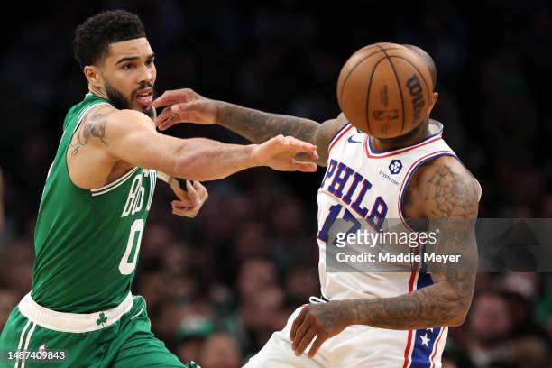 Jayson Tatum of the Boston Celtics and P.J. Tucker of the Philadelphia 76ers battle for a loose ball during the second half of game two of the...