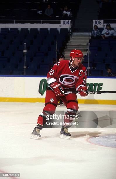 Gary Roberts of the Carolina Hurricanes skates on the ice during an NHL preseason game against the New York Islanders in September, 1997 at the...