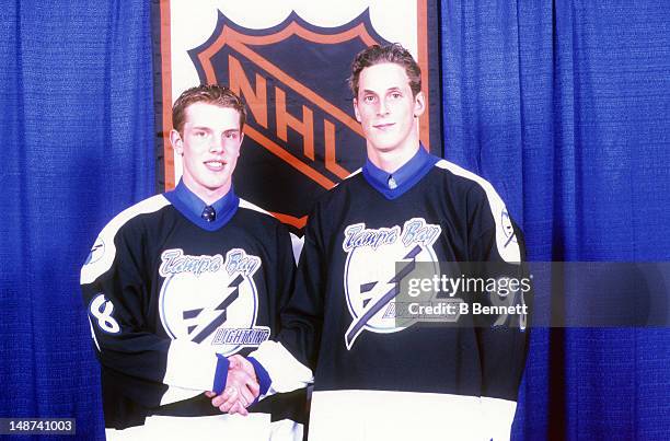 Brad Richards and Vincent Lecavalier of the Tampa Bay Lightning shake hands during the 1998 NHL Entry Draft on June 27, 1998 at the Marine Midland...