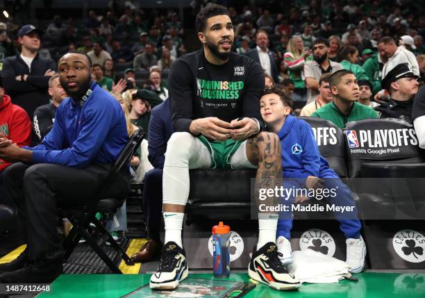 Jayson Tatum of the Boston Celtics sits with his son Deuce on the bench at the end of game two of the Eastern Conference Second Round Playoffs...