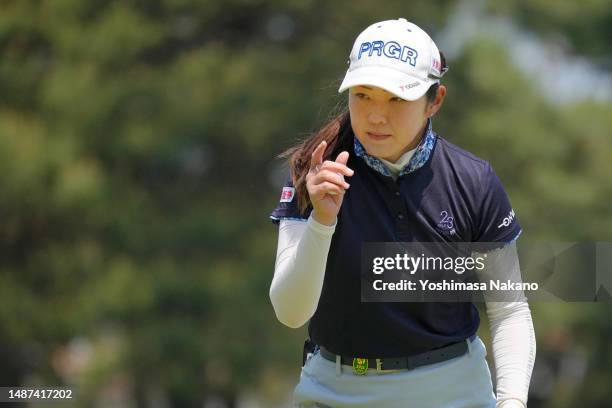 Rie Tsuji of Japan acknowledges the gallery on the 11th green during the first round of World Ladies Championship Salonpas Cup at Ibaraki Golf Club...