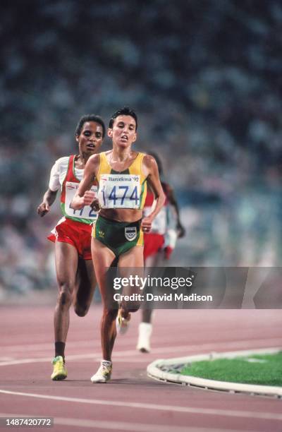 Derartu Tulu of Ethiopia and Elana Meyer of South Africa run in the Women's 10000 meters race of the Athletics competition at the 1992 Summer...