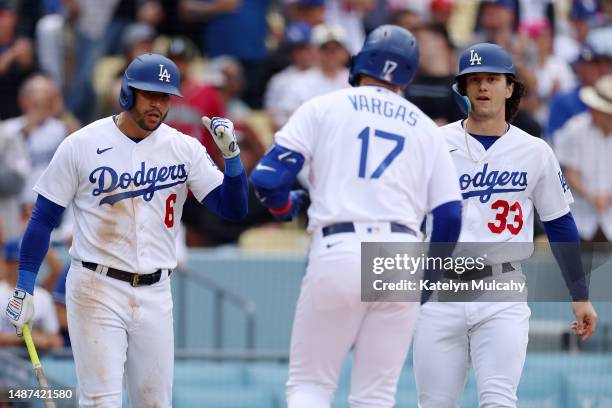 Miguel Vargas of the Los Angeles Dodgers celebrates his two run home run with teammates David Peralta and James Outman during the fourth inning...