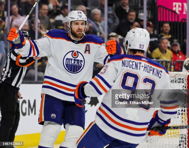 Leon Draisaitl and Ryan Nugent-Hopkins of the Edmonton Oilers celebrate Draisaitl's third-period power-play goal, his third goal of the game, in Game...