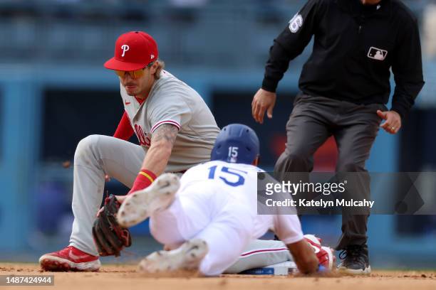 Bryson Stott of the Philadelphia Phillies gets the out at second base on Austin Barnes of the Los Angeles Dodgers on a steal attempt during the...