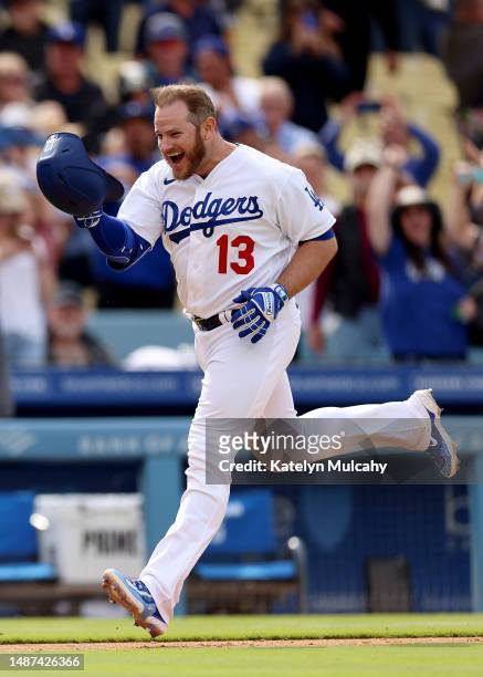 Max Muncy of the Los Angeles Dodgers celebrates his walk-off grand slam home run during the ninth inning against the Philadelphia Phillies at Dodger...