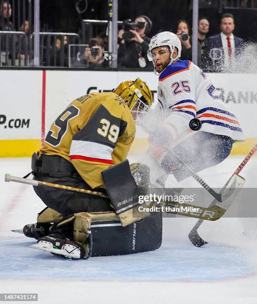 Laurent Brossoit of the Vegas Golden Knights blocks a shot by Darnell Nurse of the Edmonton Oilers in the third period of Game One of the Second...