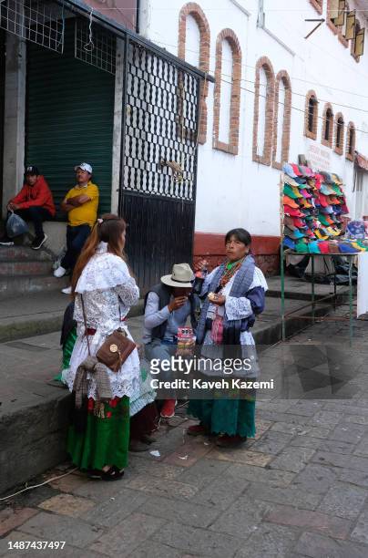 Group of Mazahua indigenous people in their costumes stand in the market place near the town square on the New year's day on January 1, 2023 in Valle...