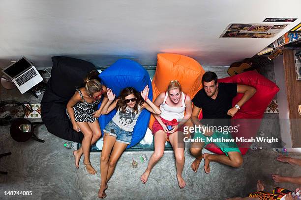 overhead of backpackers in roomates hostel. - hostel stock pictures, royalty-free photos & images