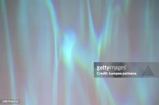 aquamarine abstract background with rays of light - rainbow confetti stock pictures, royalty-free photos & images