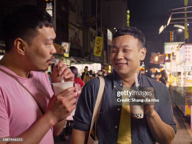 gay couple in taiwan's night market - taiwan night market stock pictures, royalty-free photos & images