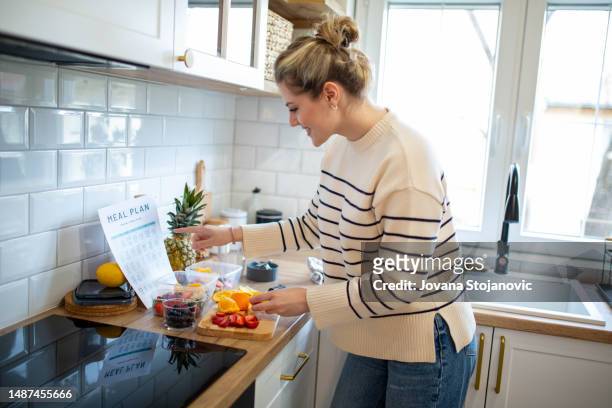 woman preparing a tasty salad - national diet of japan stock pictures, royalty-free photos & images
