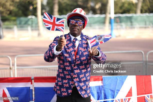 Royal fan Joseph Afrane poses for a photograph as she camps out in the royal 'superfans' camp on The Mall ahead of the coronation of King Charles...