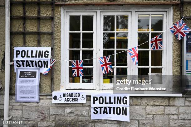 Polling station signs are seen outside Canford Cliffs Library Polling station, as people go to the polls in the local elections, on May 04, 2023 in...