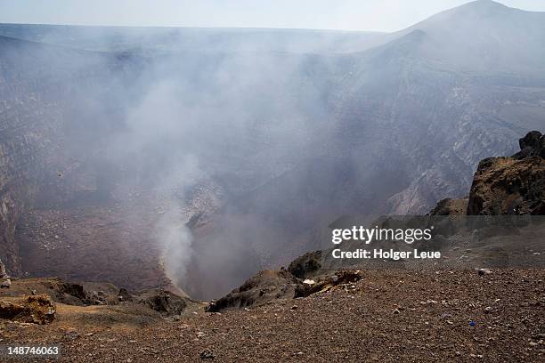 steam rising from crater of masaya volcano. - masaya volcano stock-fotos und bilder