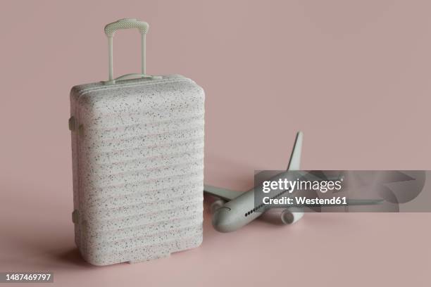 three dimensional render of suitcase and toy airplane - valise stock illustrations