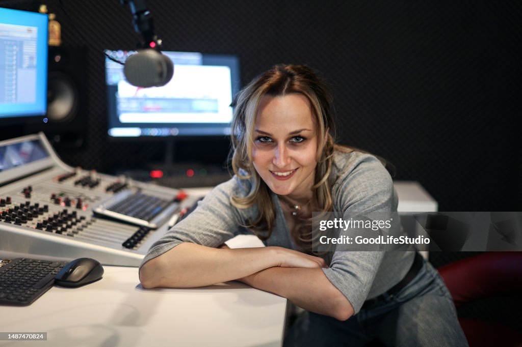 Young woman working at a radio