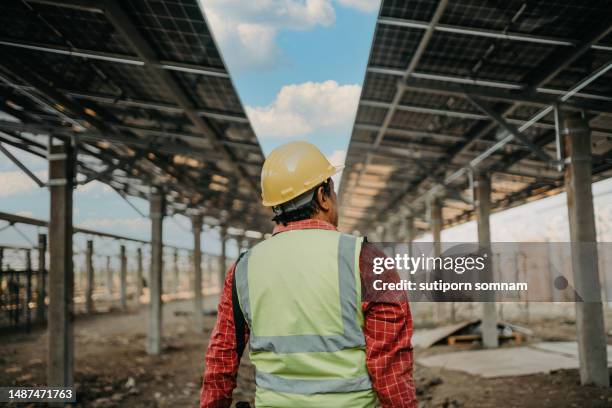 backside still photographer in the solar panel construction - photographer seascape stock pictures, royalty-free photos & images