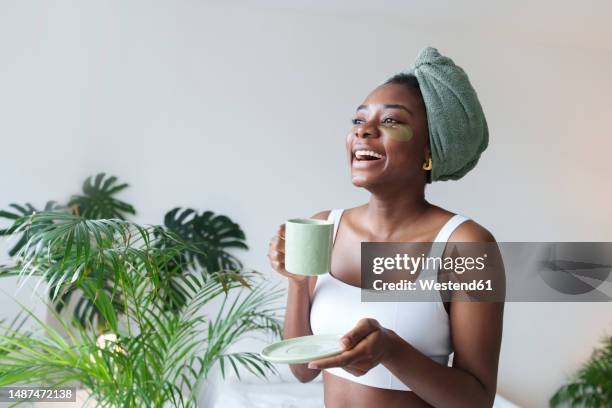 happy young woman with coffee cup - eye patch stock pictures, royalty-free photos & images