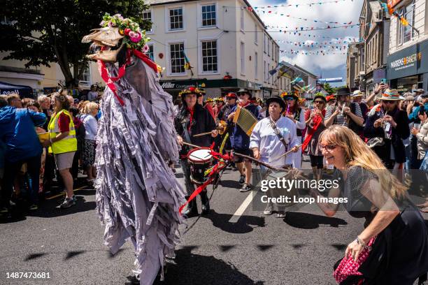Penglaz the Penzance Obby Oss and the Teazer The Bucca with musicians of the Raffidy Dumitz Band leading the Civic Procession on Mazey Day during the...