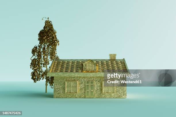 three dimensional render of gold colored house standing against blue background - posh stock illustrations
