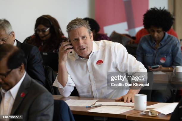 Labour leader Keir Starmer speaks to voters over the phone as he joins party activists at a national phone bank on local elections day on May 04,...