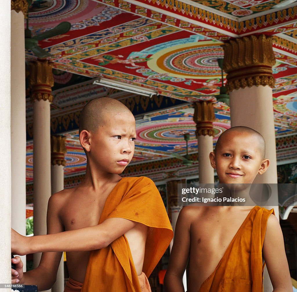 Portrait of young Buddhist monks in temple.