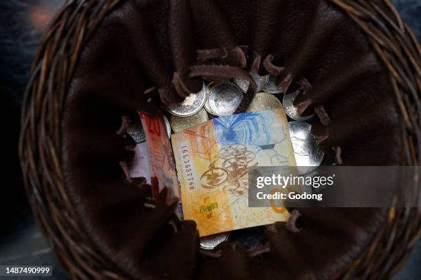 Collection During a Catholic Mass. Basket with swiss Francs. Switzerland.