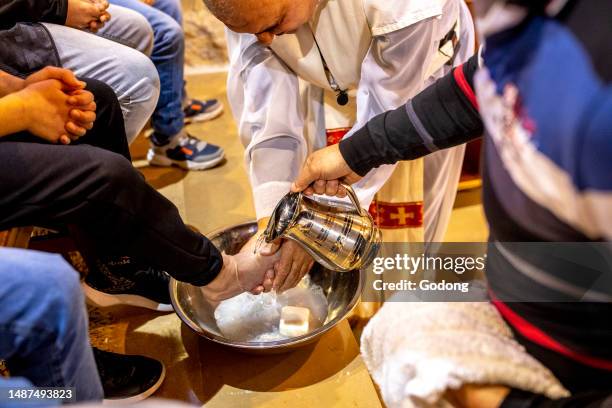 Maundy Thursday celebration in Our Lady maronite church, Bdadoun, Lebanon. Washing of the feet ritual.