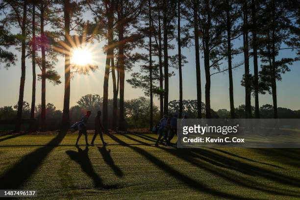 Scenic view is seen as Max Homa, Patrick Cantlay and Sahith Theegala of the United States walk up the tenth hole during the first round of the Wells...