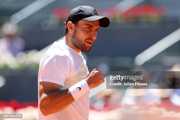 Aslan Karatsev celebrates winning match point against Zhizhen Zhang of People's Republic of China during the Men's Quarter Final match on Day Eleven...