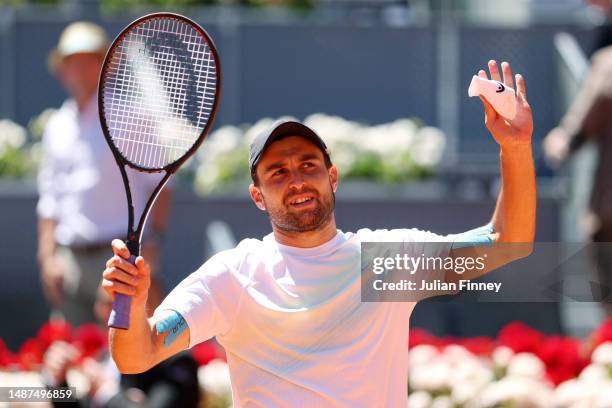 Aslan Karatsev acknowledges the crown after winning match point against Zhizhen Zhang of People's Republic of China during the Men's Quarter Final...