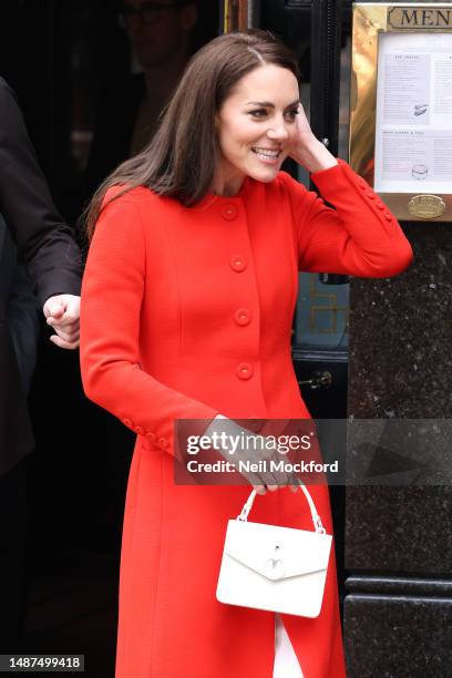 Prince William, Prince of Wales and Catherine, Princess of Wales leaving the Dog & Duck pub during their visit to Soho on May 04, 2023 in London,...