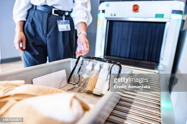 close up shot of a full tray before a x-ray scan at airport security - border control stock pictures, royalty-free photos & images