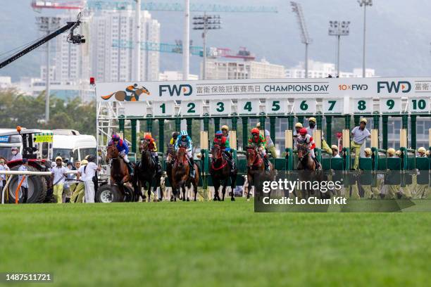 Jockeys compete in the Race 8 FWD Queen Elizabeth II Cup at Sha Tin Racecourse on April 30, 2023 in Hong Kong.