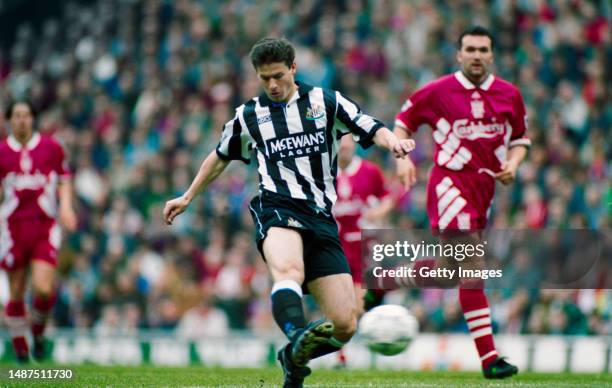 Newcastle player Robert Lee shoots to score the first goal during the FA Premier League match between Liverpool and Newcastle United at Anfield on...