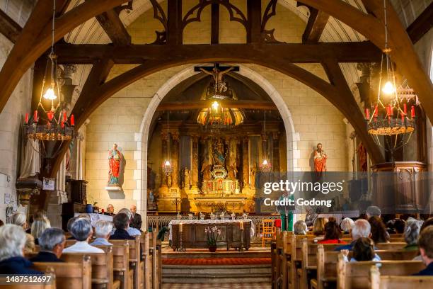 Mass in Saint Peter's catholic church, La Vieille Lyre, Eure, France.