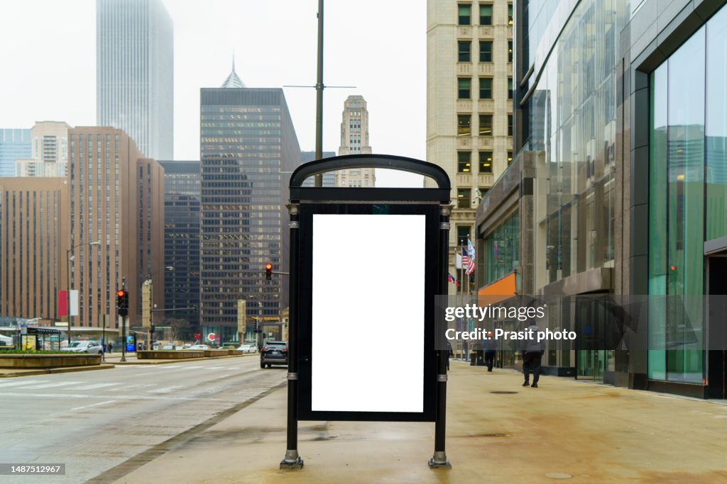 White mock up blank vertical billboard on the city street for advertisement in Chicago, Illinois, USA