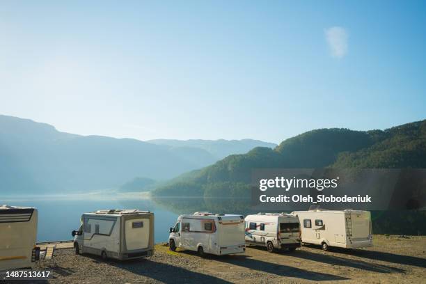 camping with camper vans near the lake in norway - camper trailer stock pictures, royalty-free photos & images