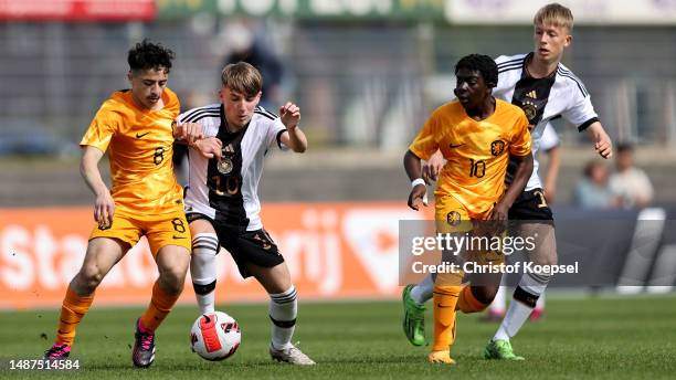 Lennart Karl of Germany challenges Luka Vieillevoye of Netherlands during the international friendly match between U15 Netherlands and U15 Germany at...