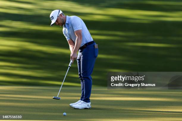 Austin Cook of the United States putts on the third green during the first round of the Wells Fargo Championship at Quail Hollow Country Club on May...