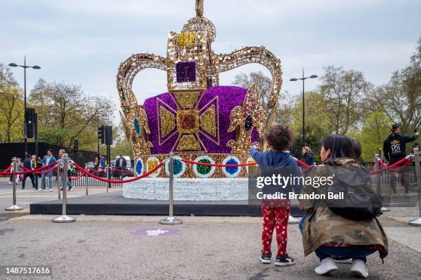 People view a replica of the St Edward's Crown on May 04, 2023 in London, England. The Coronation of King Charles III and The Queen Consort will take...