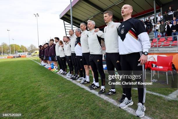 The team of Germany with head coach Marc-Patrick Meister sings the national anthem prior to the international friendly match between U15 Netherlands...