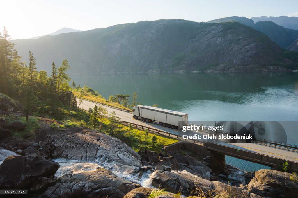 Truck on the road near Låtefossen waterfall in Norway