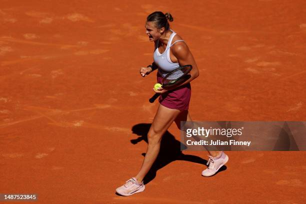 Aryna Sabalenka celebrates a point against Maria Sakkari of Greece during the Women's Singles Semi-Final match on Day Eleven of the Mutua Madrid Open...